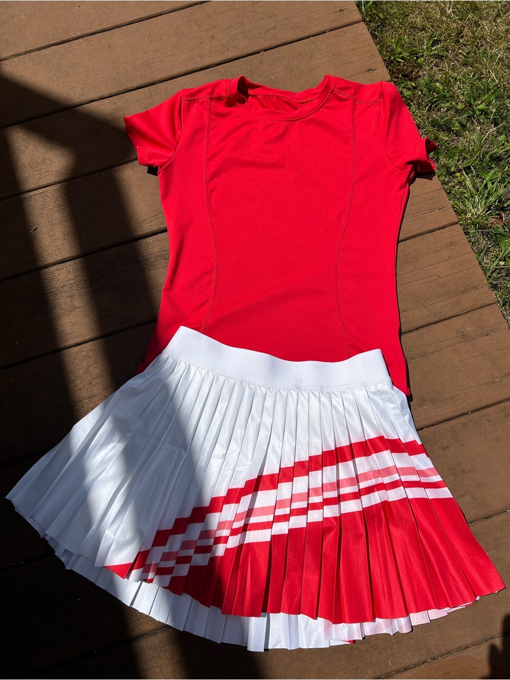 Red Athletic Shirt with White Pleated Athleta Skirt